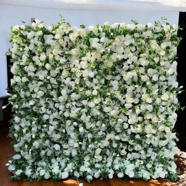 Elegant white flower wall backdrop with lush greenery for weddings