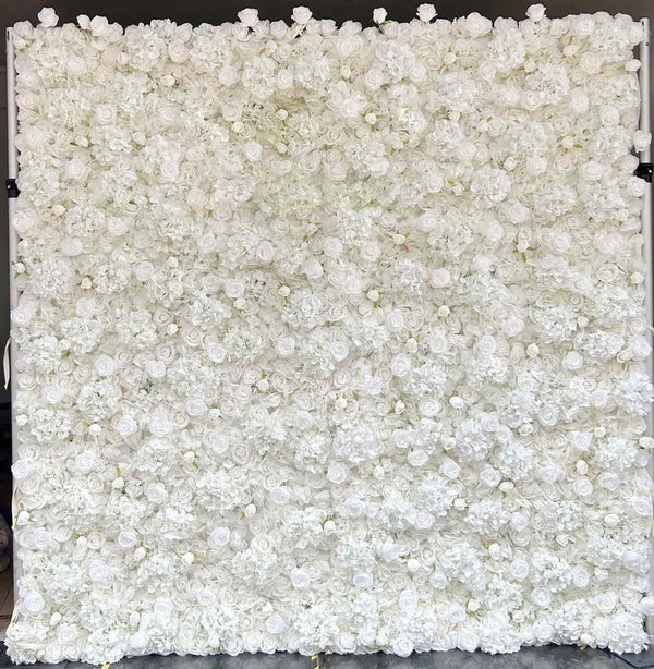 Elegant white flower wall backdrop with lush greenery for weddings