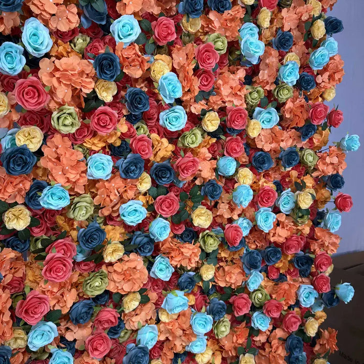 Close-up of colorful artificial roses mixed with orange hydrangeas.