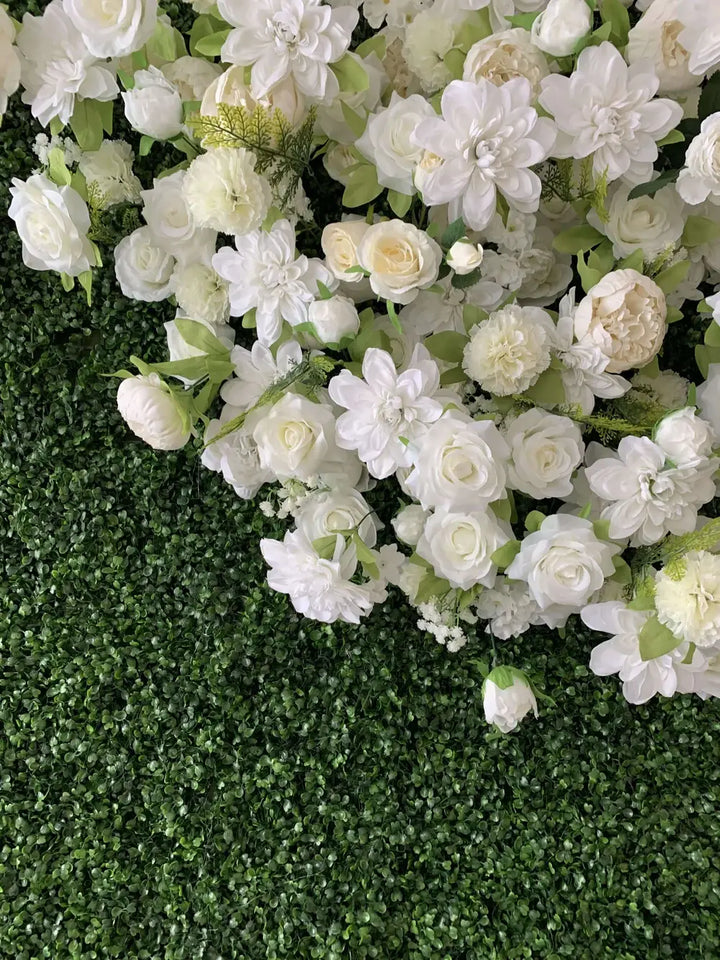 Close-up of white roses and florals on decorative flower wall