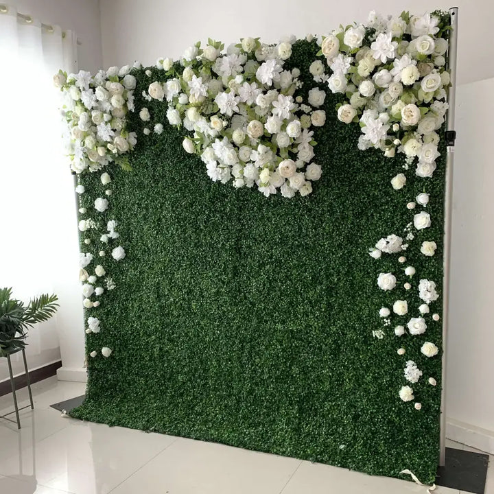 Angled view of boxwood floral wall backdrop with clustered blooms