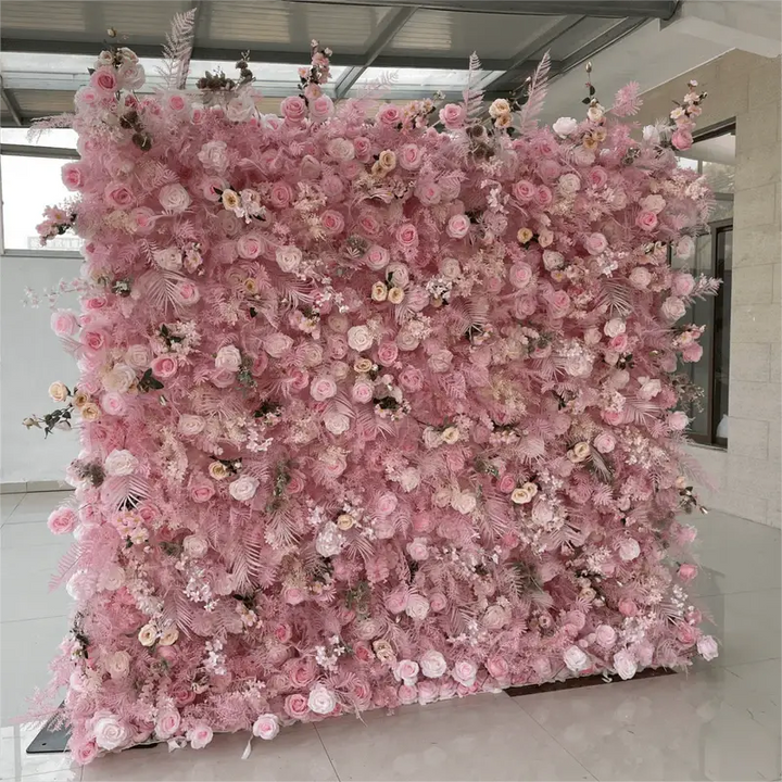 Close-up of decorative pink flower wall with varied blooms and textures.