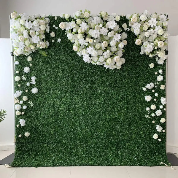 Green boxwood flower wall backdrop with white floral accents