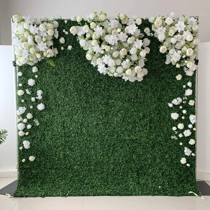 Green boxwood flower wall backdrop with white floral accents