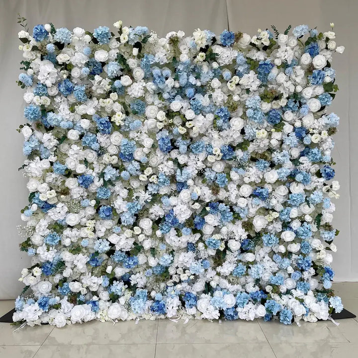 White and blue floral wall backdrop featuring roses and hydrangeas.