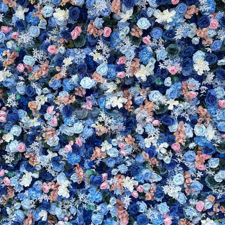 Close-up of mixed navy, blush, and cream flowers with textured greens