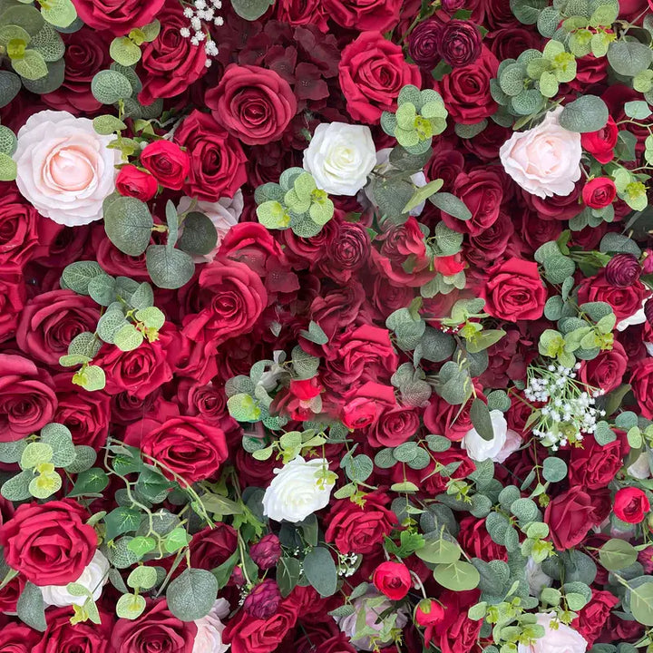 Richly decorated floral backdrop with varied shades of red roses for upscale events.