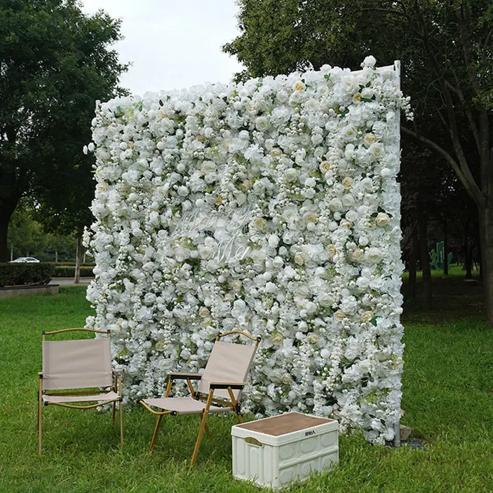 Close-up of white roses and soft cream florals on decorative backdrop