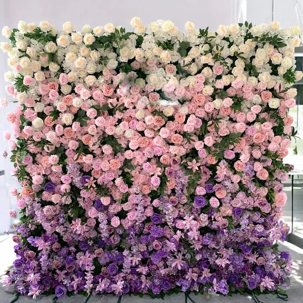 Pastel-colored floral wall backdrop with roses and lilacs for elegant events.
