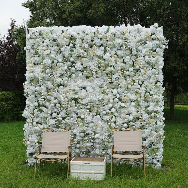 Outdoor white rose flower wall backdrop with chairs set for event