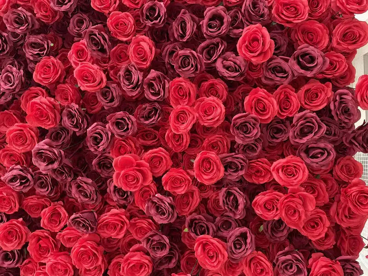 Close-up of vibrant red roses in a decorative flower wall, ideal for event backdrops.
