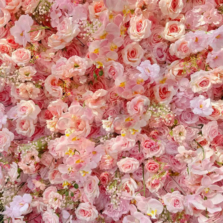 Close-up of soft pink floral backdrop with intricate flower arrangements for weddings.
