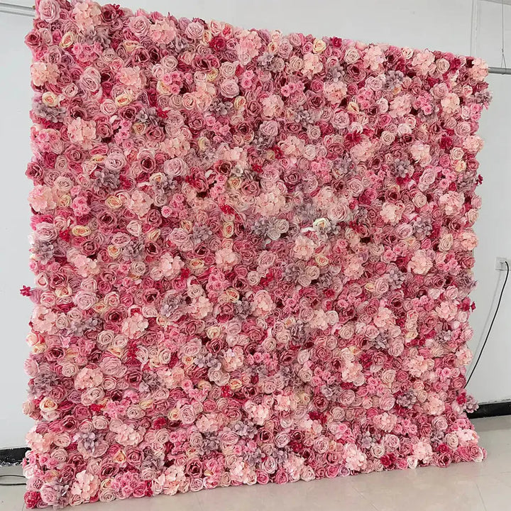 Full view of pink rose and hydrangea flower wall backdrop set up against a white background