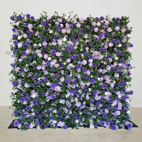 Close-up of lush flower wall with various shades of purple and pink roses.