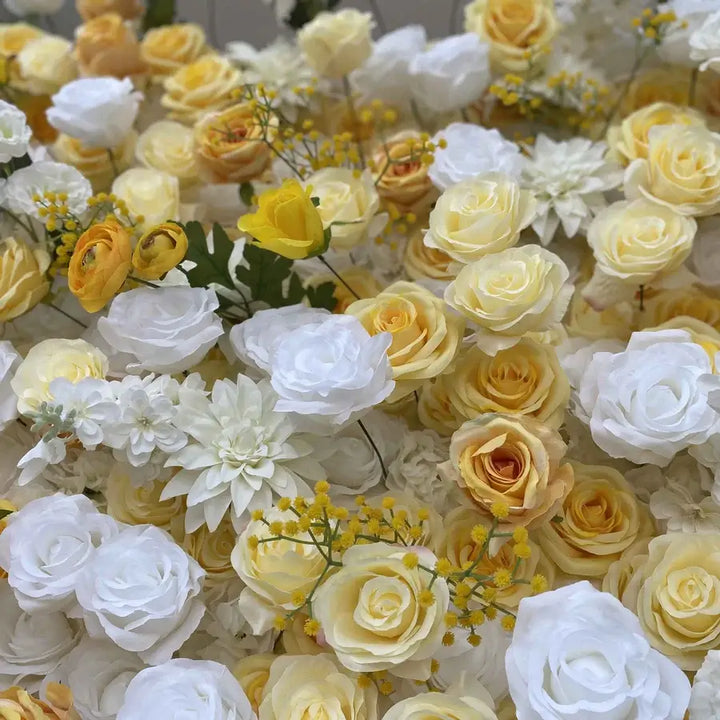 Detailed view of mixed floral wall backdrop featuring roses and daisies.