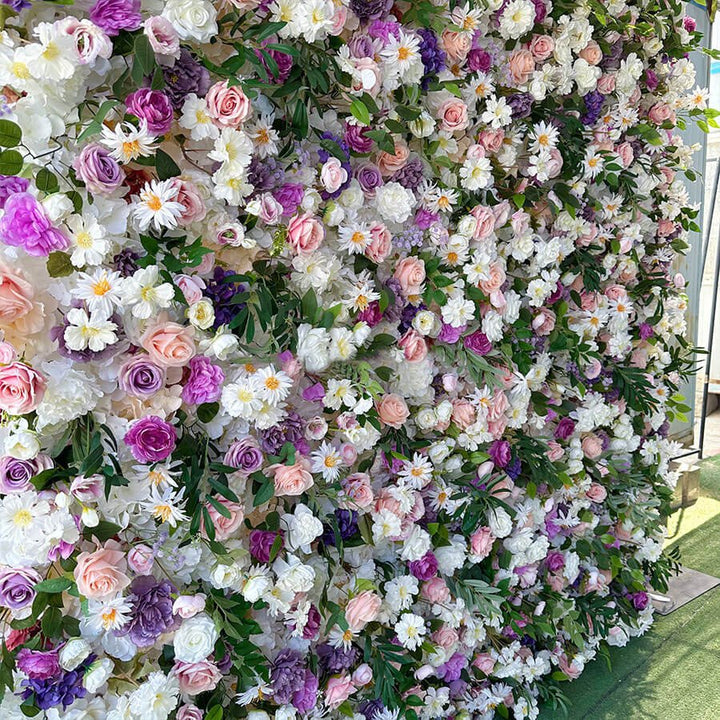Angled close-up showing detailed textures of white, peach, and purple flowers.