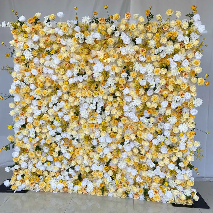 Close-up of yellow and white roses on a luxurious flower wall backdrop.