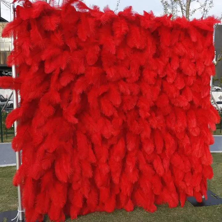 Outdoor setup of the red decorative flower wall used for party or prom backdrop