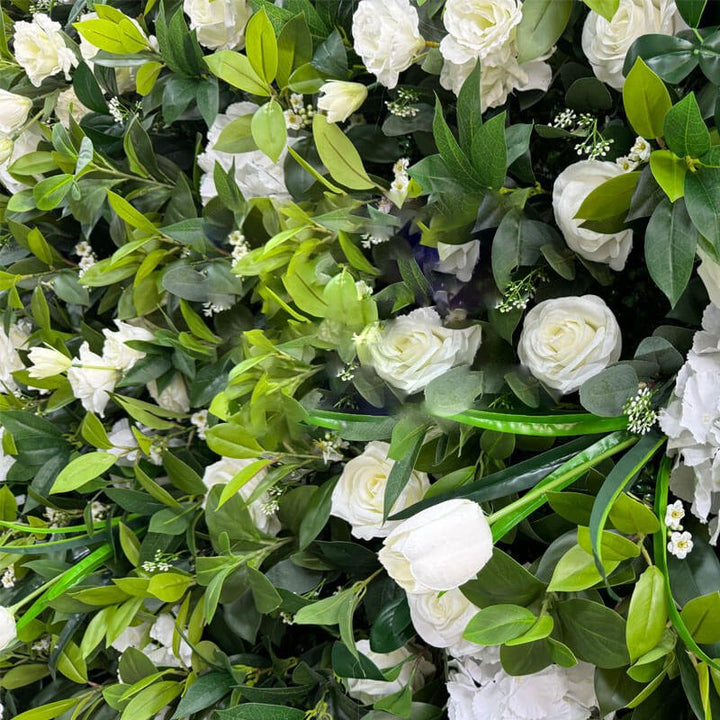 Dense floral backdrop featuring white flowers for weddings.