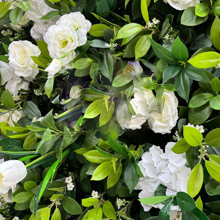 Vibrant garden wall with white flowers perfect for event decor.