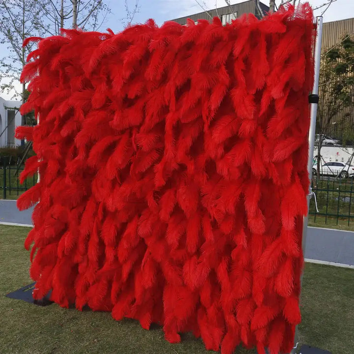 Side view of the Crimson Plume flower wall showing feather texture and dimension
