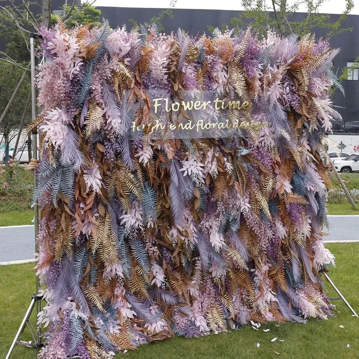 Side angle of floral backdrop showcasing pastel and bronze ferns with text overlay