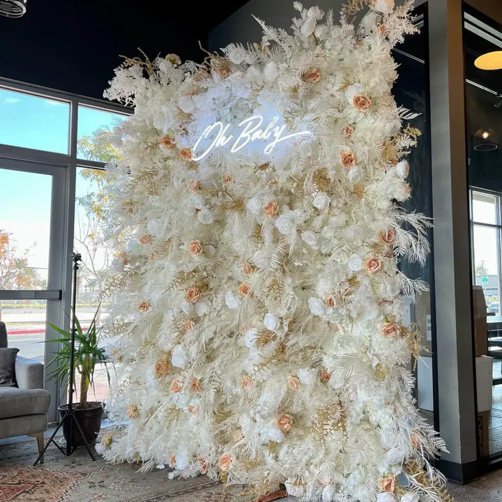 Side angle of white and gold dried floral wall, perfect for event backdrops.