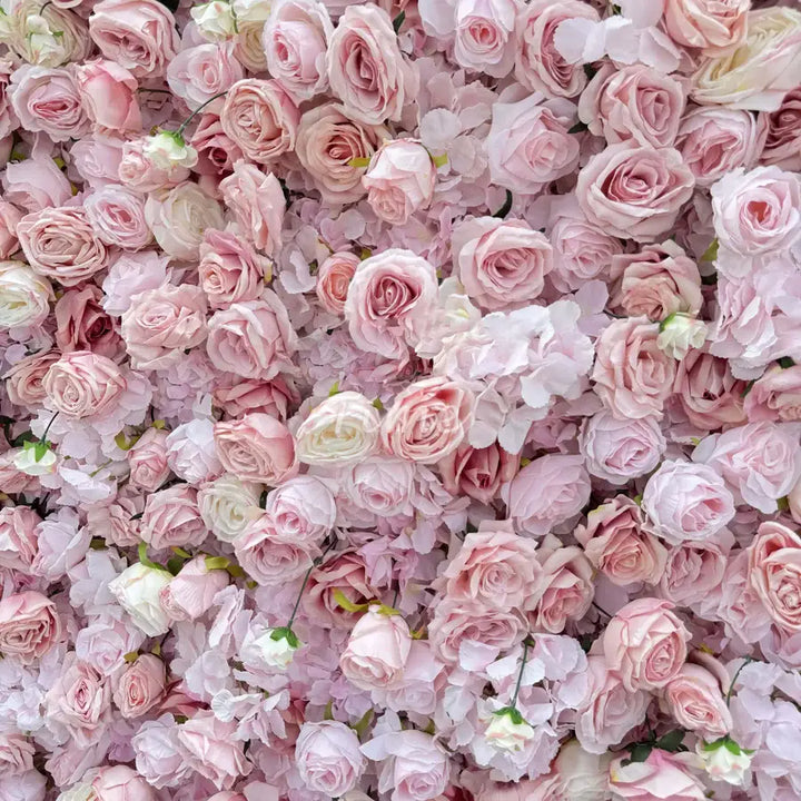 Full view of a large pastel rose flower wall backdrop at a wedding.