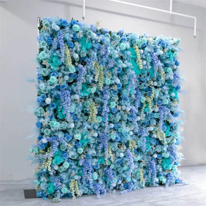 Close-up of layered flowers including roses, orchids, and faux wisteria in cool tones