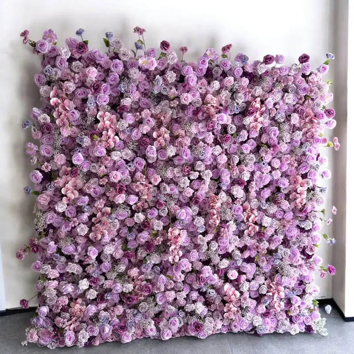 Elegant floral wall backdrop with vibrant shades of purple and pink for weddings and parties.