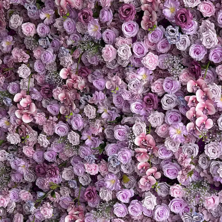 Decorative flower wall featuring a mix of purple and pink blooms for glamorous event settings.