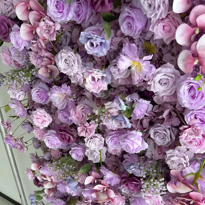 Vivid decoration wall flowers in purple and pink, enhancing the festive atmosphere at celebrations.