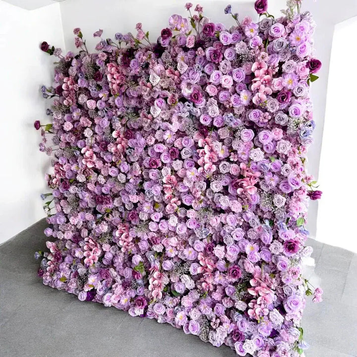 Elegant floral wall backdrop with vibrant shades of purple and pink for weddings and parties.