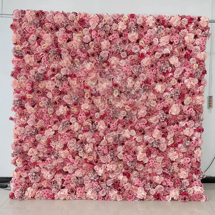 Full view of pink rose and hydrangea flower wall backdrop set up against a white background