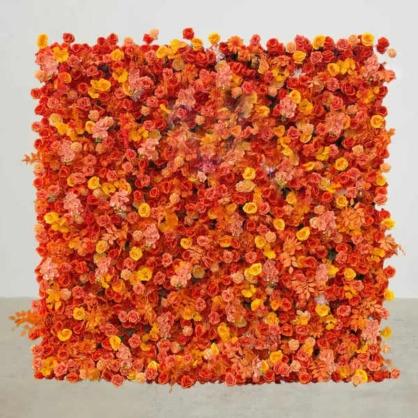Full view of vivid orange and yellow flower wall backdrop with layered blooms