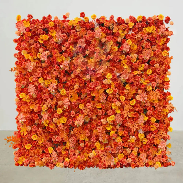 Full view of vivid orange and yellow flower wall backdrop with layered blooms