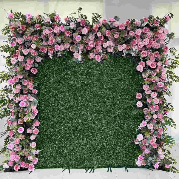 Lush greenery and pink rose flower wall backdrop for events