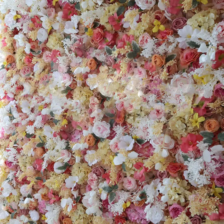 Close-up of dense wall flowers in soft pink and warm yellow tones