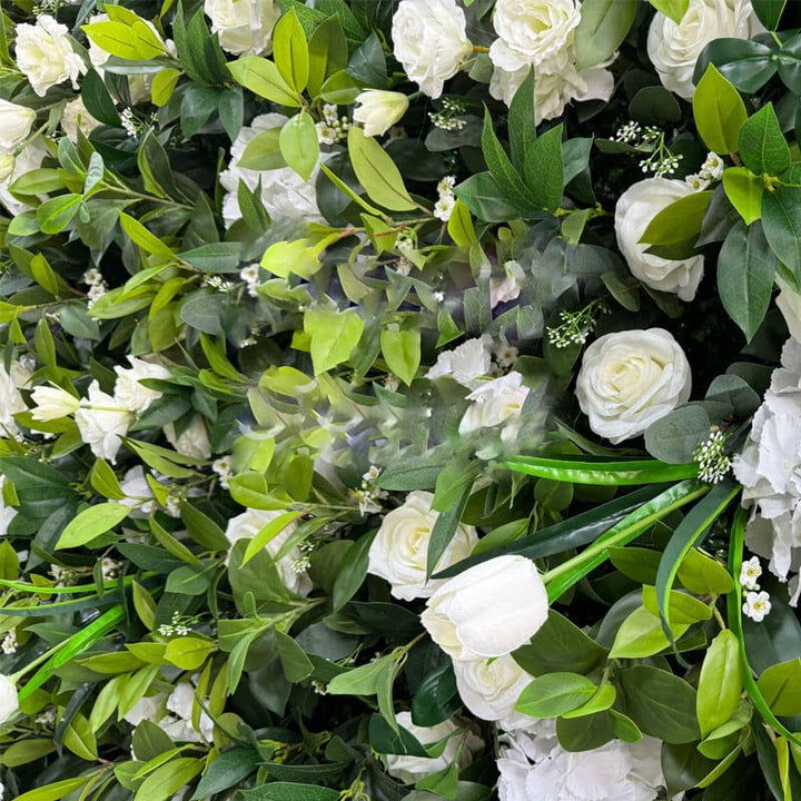 Floral backdrop with white blooms and foliage for weddings