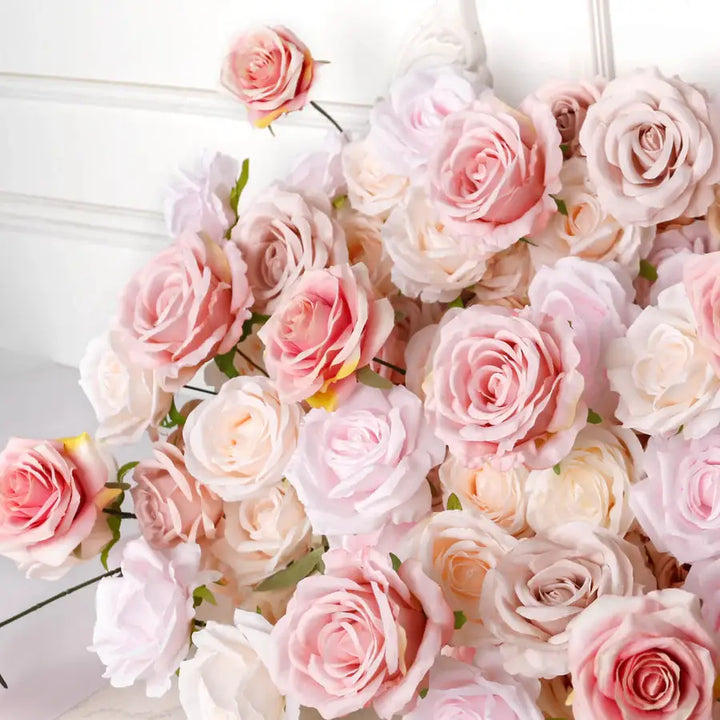 Blush rose heads in various pastel tones in a romantic floral display