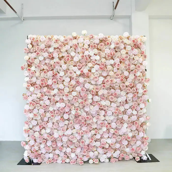 Close-up of soft pink artificial rose flowers arranged on a marble table