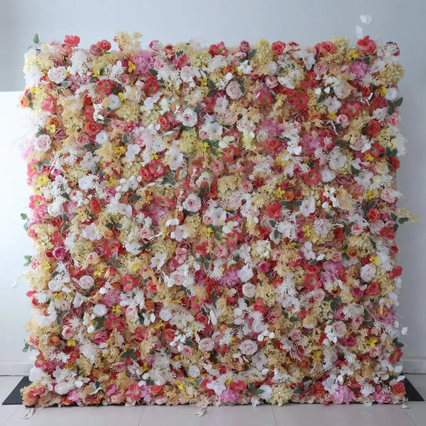 Multicolor flower wall backdrop featuring peach, coral, and white florals