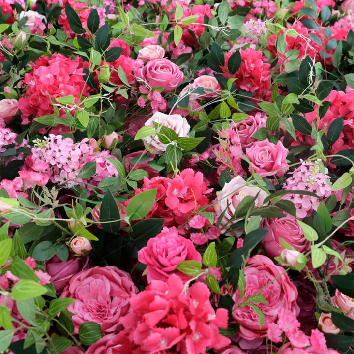 Angled shot showing texture and layers of pink blooms with natural greenery