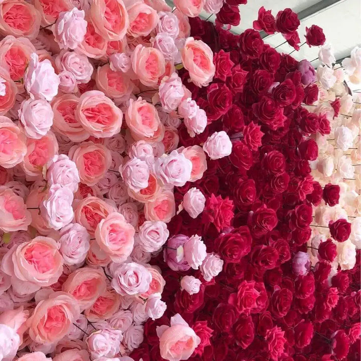 Close-up of deep red and pale pink roses in decorative flower wall