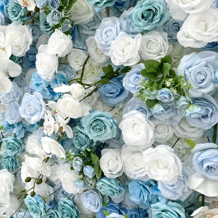 Close-up of blue and white wall flowers with orchids
