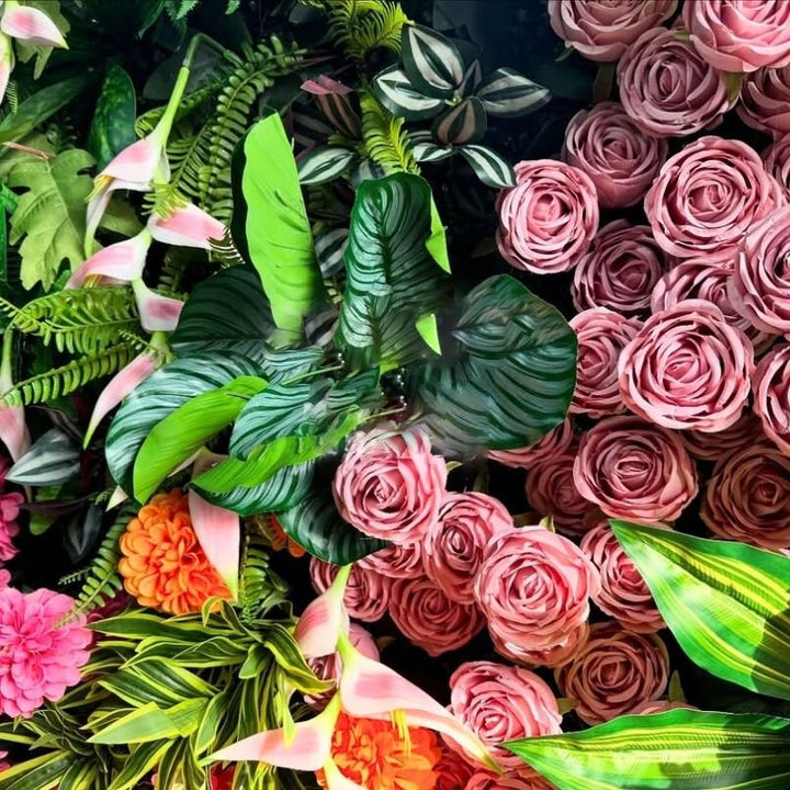 Lush floral backdrop featuring roses and mixed foliage, ideal for weddings and parties.