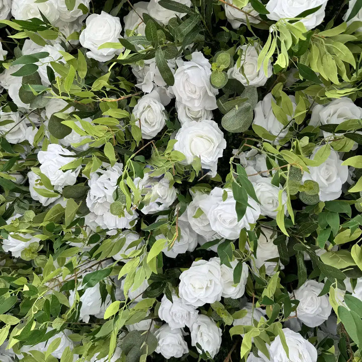 White rose floral backdrop with vibrant green leaves perfect for events