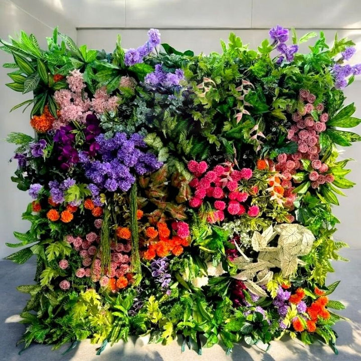 Vibrant garden flower wall backdrop with a colorful array of blooms perfect for event decor.