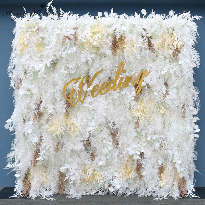 Wedding flower wall backdrop with gold "Wedding" sign for events.