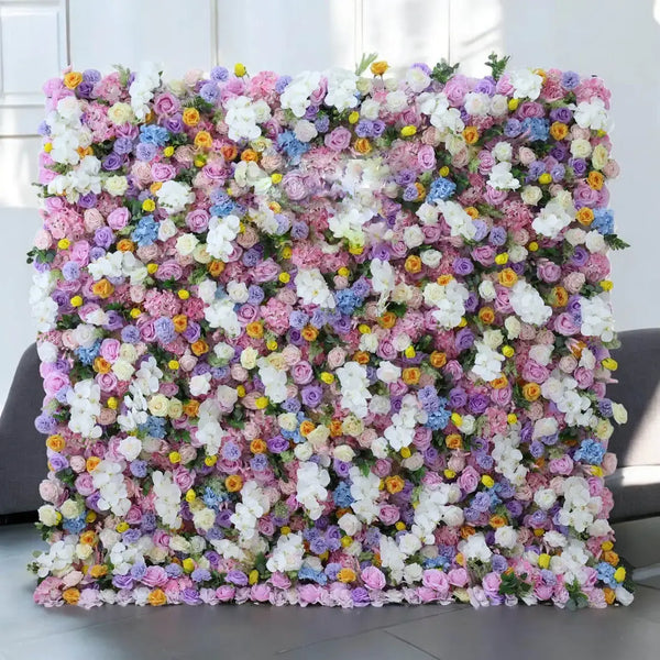 Pastel-colored flower wall backdrop, perfect for adding a romantic touch to wedding venues.